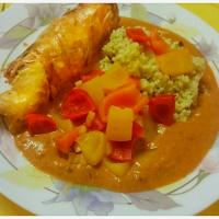 Rolled Turkey Steak filled with cream cheese and dried tomatoes with Hirse, peppers and tomatoe sauce